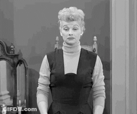 Black And White Woman In Turtleneck And Dress GIF
