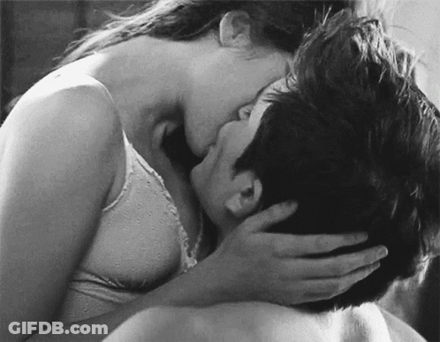 Black And White Woman Kissing Man On Neck GIF