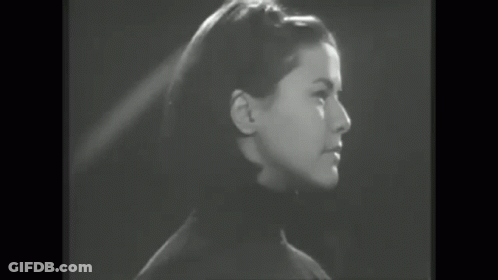 Black And White Woman Laughing In Crowd GIF