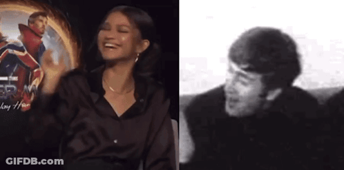 Black And White Woman Laughing Next To Man Laughing GIF