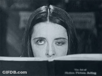 Black And White Woman Looking Through Window GIF