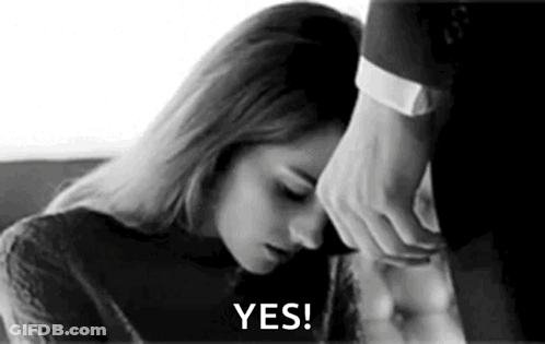 Black And White Woman Lying On Man's Lap Man Holding Head GIF