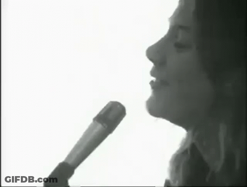 Black And White Woman Singing Into Microphone GIF
