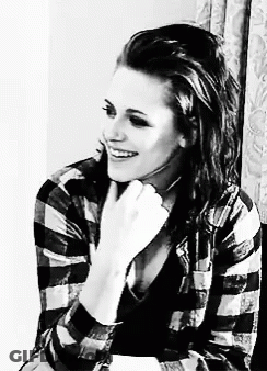 Black And White Woman Smiling In Plaid Shirt GIF