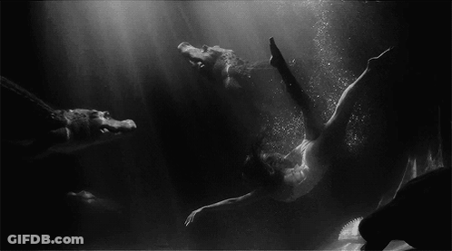 Black And White Woman Swimming In Water GIF