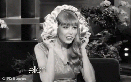 Black And White Woman Wearing Wig On Show GIF