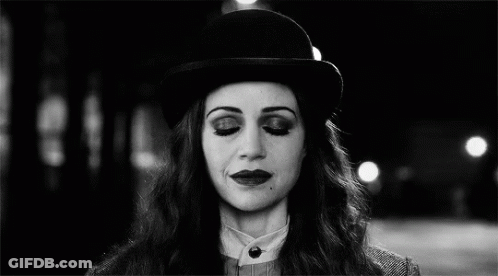 Black And White Woman With Bowler Hat And Glowing Eyes GIF