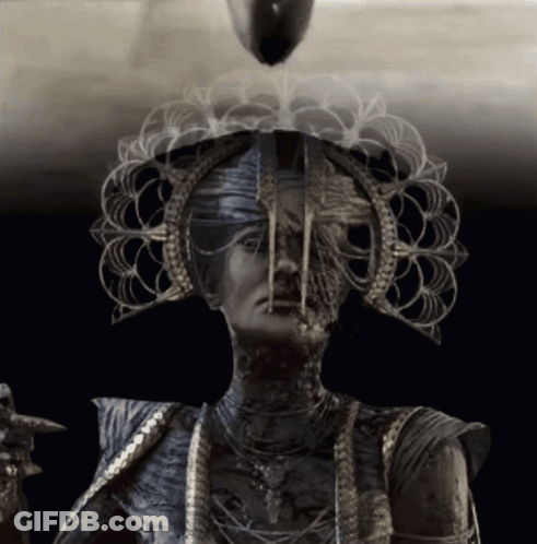 Black And White Woman With Crown And Necklaces GIF