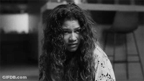 Black And White Woman With Curly Hair Making Sad Face GIF
