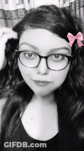 Black And White Woman With Glasses And Pink Bow GIF