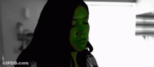 Black And White Woman With Green Face Paint GIF