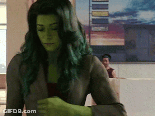 Black And White Woman With Green Face Paint GIF