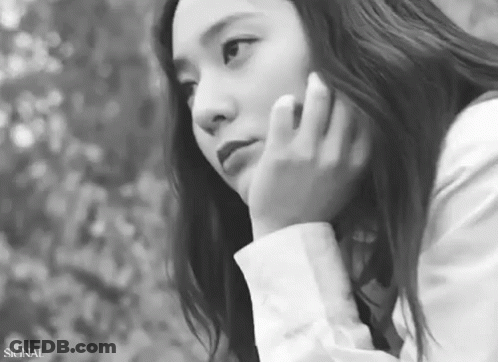 Black And White Woman With Hand On Face GIF