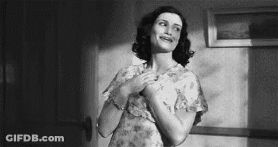 Black And White Woman With Hands On Chest GIF