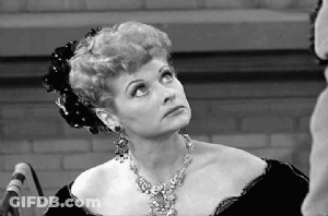 Black And White Woman With Necklace Looking Up GIF