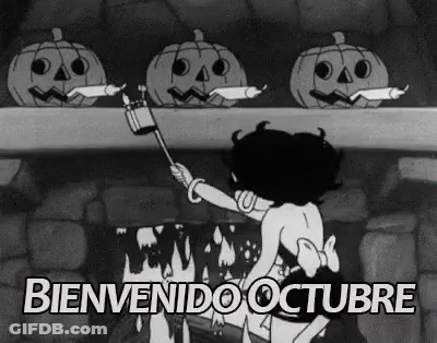 Black And White Woman With Pumpkins By Fireplace GIF