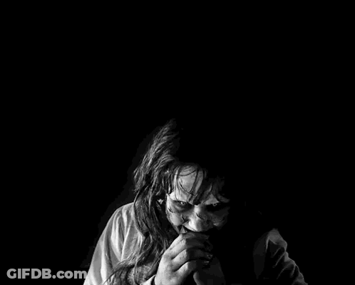 Black And White Woman With Scary Face In Dark GIF
