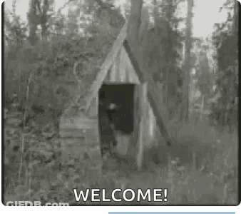 Black And White Wooden House In Woods Saying Welcome GIF