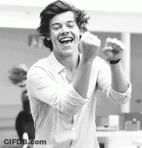 Black And White Young Man Laughing With Fist Up GIF