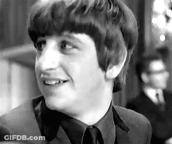 Black And White Young Man Smiling In Suit And Tie GIF