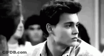 Black And White Young Man With Ponytail GIF