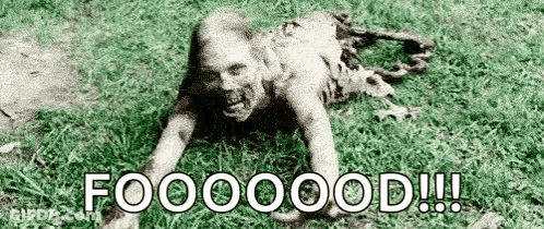 Black And White Zombie Crawling In Grass Saying Foooood GIF