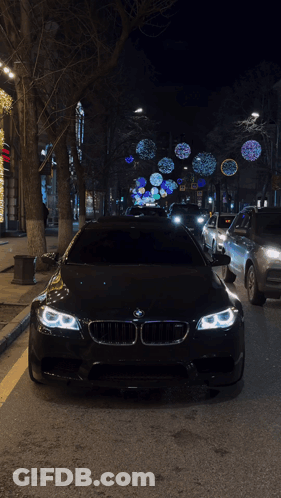 Black BMW Parked On Side Of Road GIF