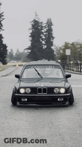 Black BMW Parked On Street GIF