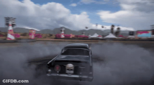 Black Car Drifting On Track With Smoke GIF