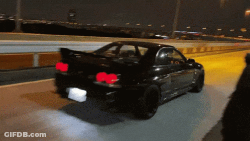 Black Car Driving On Highway At Night Red Lights GIF