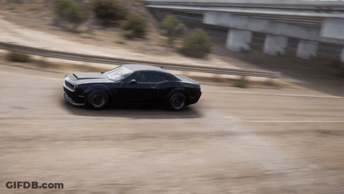 Black Car Driving Under Bridge GIF