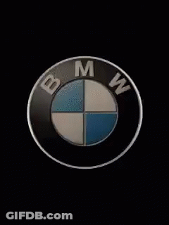 Black Car Silhouetted Against Spotlight GIF