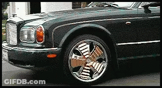 Black Car With Fan Shaped Wheel GIF