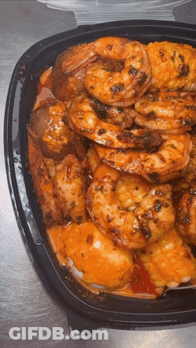 Black Container With Shrimp Chicken And Potatoes GIF