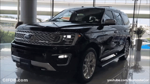 Black Ford Expedition Parked In Showroom GIF