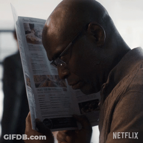 Black Guy Behind Newspaper Hiding Meme GIF