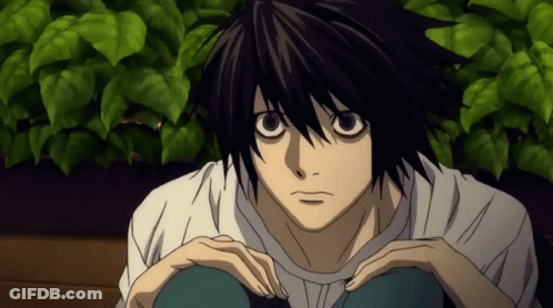 Black Haired Anime Character In White Shirt Sitting GIF