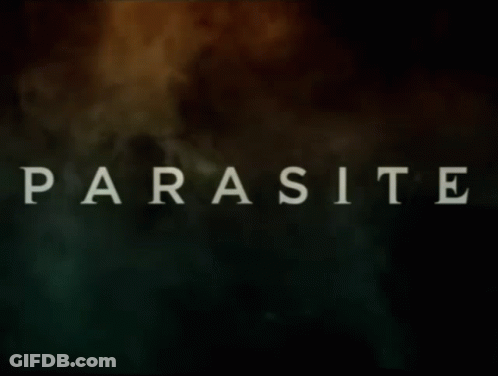Black Jacket Man Telling Woman I Have A Parasite GIF