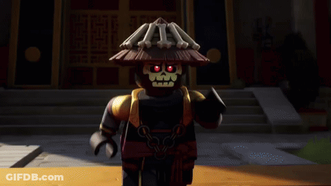 Black Lego Figure With Straw Hat In Front Of Building GIF
