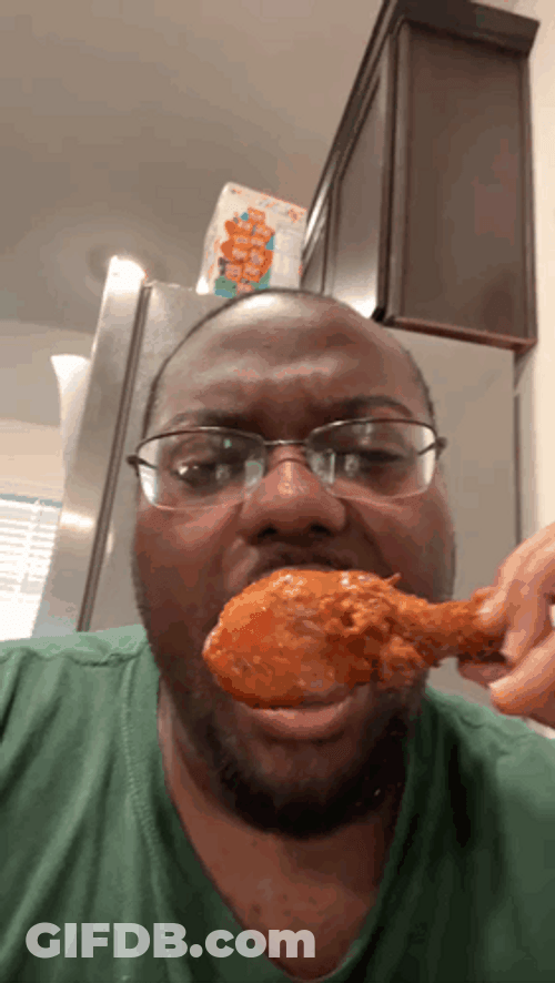 Black Man Eating A Hot Chicken Wing GIF