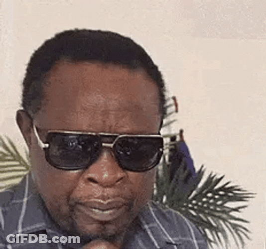 Black Man Glasses Off Squinting GIF