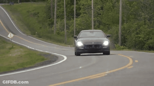 Black Maserati Driving Down Curvy Country Road GIF
