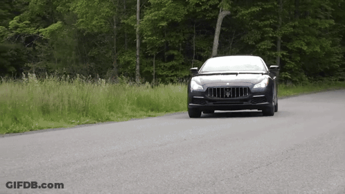 Black Maserati Driving Down Road GIF