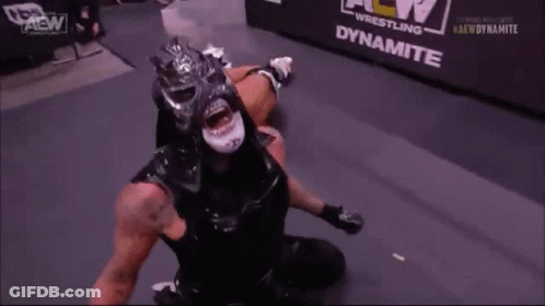 Black Masked Wrestler Open Mouth In Ring GIF