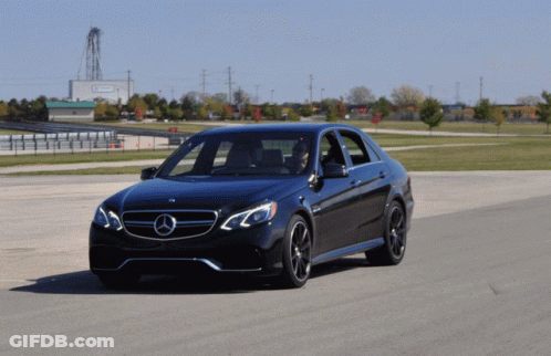 Black Mercedes Driving Past Emerson Building GIF