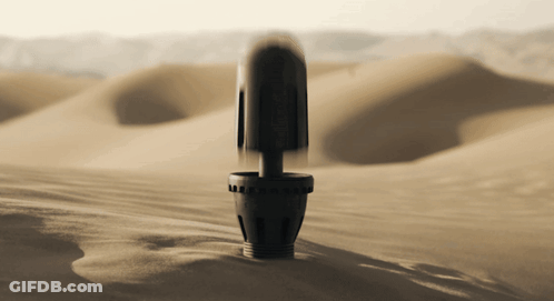 Black Object In Sandy Desert GIF