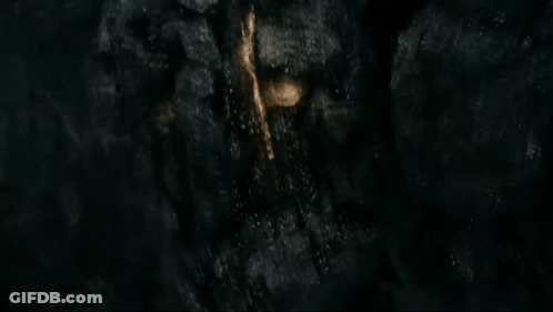 Black Rock With Gold Object GIF