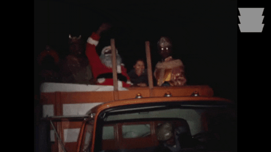 Black Santa Riding Truck At Night GIF