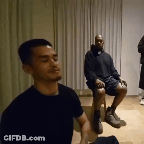 Black Shirt Man Beside Black Sweater Man GIF