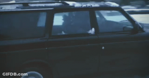 Black SUV Driving Through Snow GIF